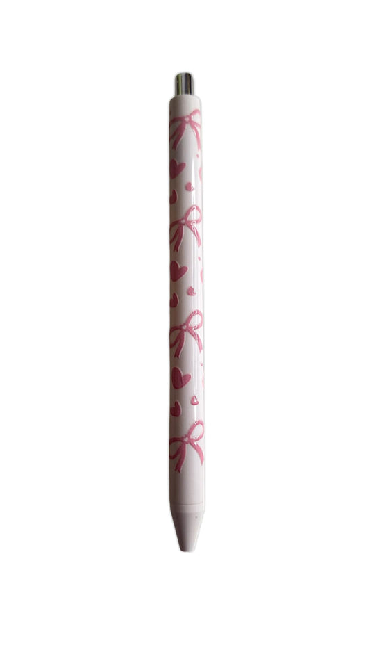 Stylo à encre noire avec nœuds et cœurs roses