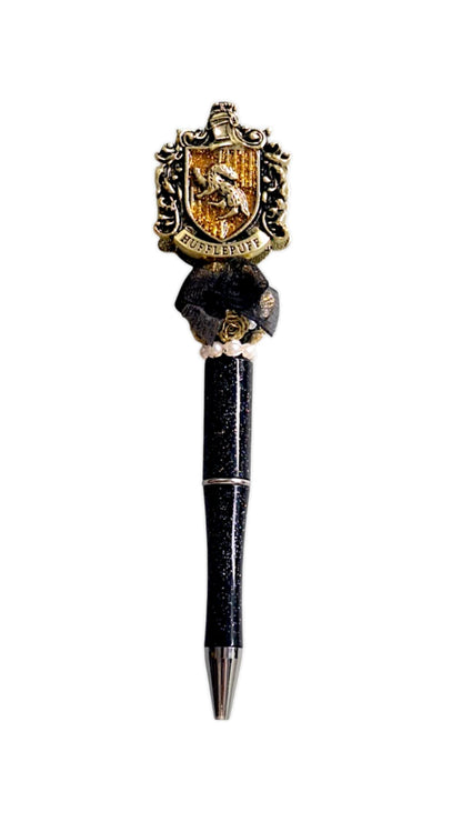 Stylo à perles dorées