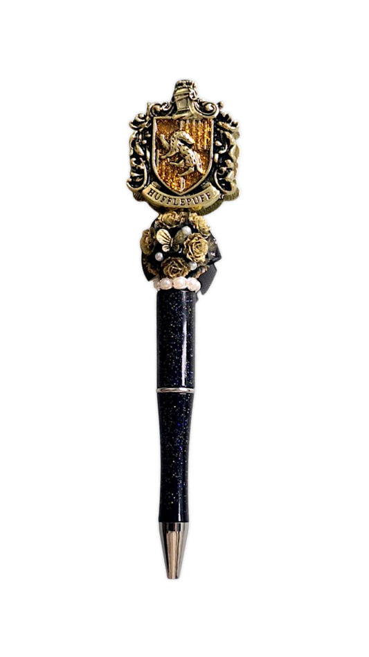 Stylo à perles dorées